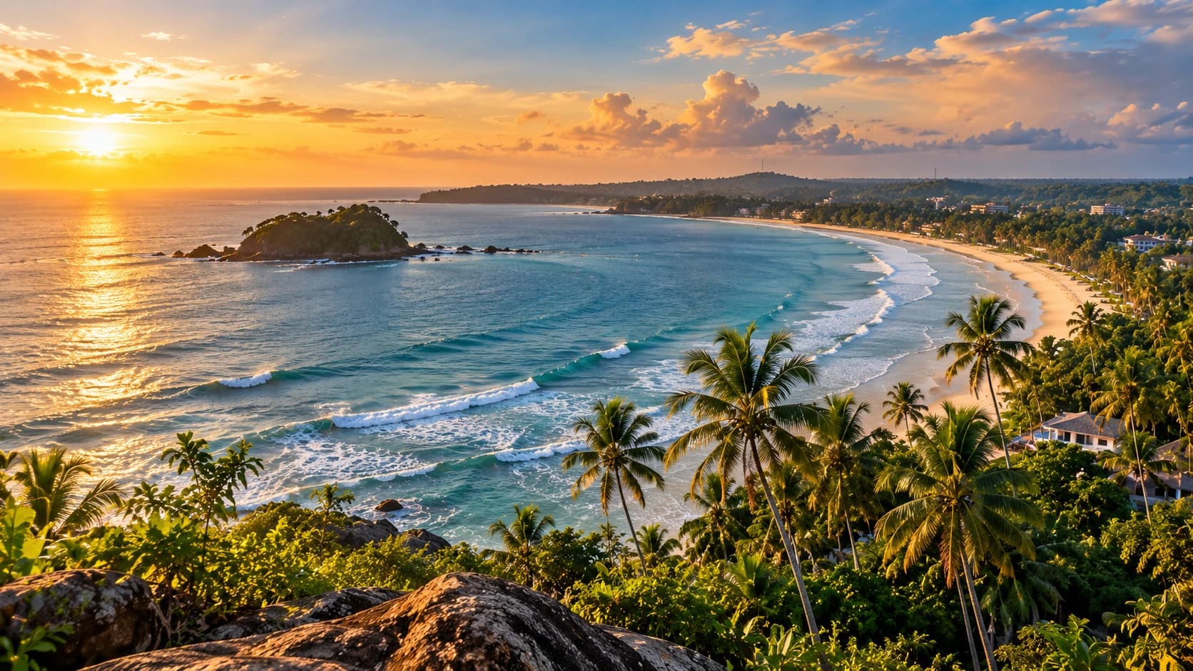 A palm-fringed tropical bay and a small island at sunset